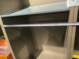 a measuring tape on a shelf in a store