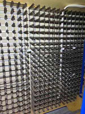 a picture of a rack of wine bottles in a wine cellar