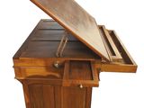 an image of a wooden desk with a drawer underneath it