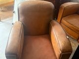 a brown chair and a brown chair in a room