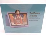packaging of a purple tablet with a little girl sitting on top of it