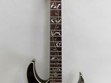 an electric guitar sitting on top of a white surface