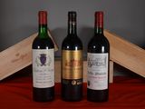 trois bouteilles de vin posées l'une à côté de l'autre sur une table