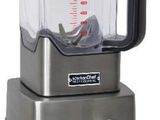 a silver blender with a glass container on top of it