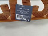 a wooden elephant that is sitting on a shelf