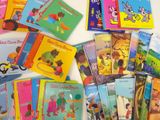 many children ' s books that are on the table