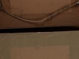 two boxes with wires attached to them in a room
