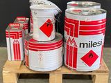 several cans of milk are stacked on a pallet on a pallet