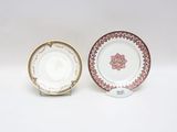 pair of porcelain plates and saucer with floral decoration