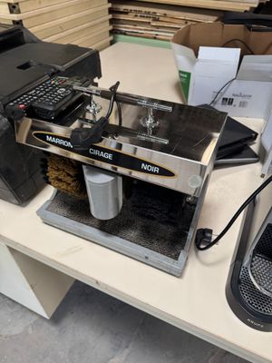 a coffee machine that is sitting on a table