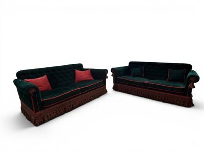 two couches that are sitting next to each other