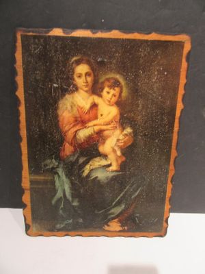 a picture of a painting of a woman holding a baby