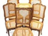 six chairs and a stool are arranged in a circle on a white background