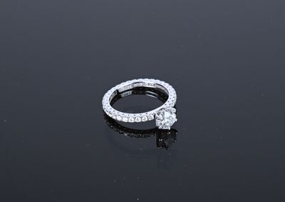 Curieuse bague "solitaire formant alliance or blanc 750/1000…