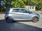a picture of a silver car parked in a parking lot