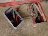 two buckets of tools sitting on the floor next to each other