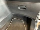 a close up of a car ' s interior with the door open