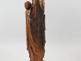 an old wooden statue of a woman holding a child in her arms