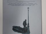 a picture of a book with a man on a boat in the water