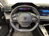 the interior of a car with a steering wheel and dashboard controls