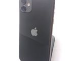 a black iphone sitting on a stand on a white surface