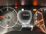 a close up of a car dashboard with a speedometer and gauges