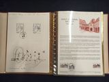an open book with a drawing on it on a table