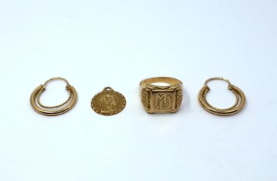 three gold rings and a ring with a coin on it