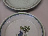 several plates with designs on them are sitting on a table