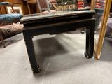 a black table with a mirror on top of it