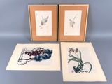 deux tableaux encadrés représentant des fleurs et des fruits posés sur une table