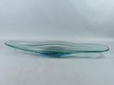 a close up of a glass bowl on a white surface