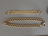 two chains that are laying on a table