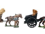 trois figurines représentant des chevaux tirant une charrette chargée de pain