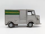 a toy truck that is sitting on a white surface