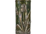an image of a green vase with flowers on it on a white surface
