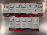 six packages of canon ink cartridges sitting on top of a metal table