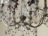 a chandelier with a bunch of candles hanging from it
