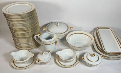 a lot of plates and cups that are sitting on a table