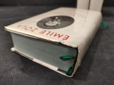 a white book with a picture of a woman on it