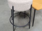 two stools and a table in a room