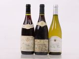 three bottles of wine sitting next to each other on a table
