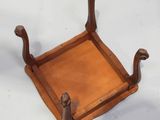 an image of a wooden tray with a handle on it