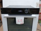 a black and white oven sitting on top of a cardboard box