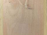 a picture of a piece of wood with a wire on it