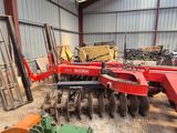 an image of a tractor with a plow attachment in a building
