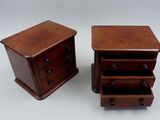 two small wooden drawers with drawers on each side of them
