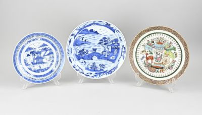 three blue and white plates with designs on them sitting on a table