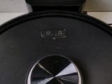 a close up of a black robot on a counter