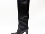 black leather high heel boots with a wooden heel on a white background